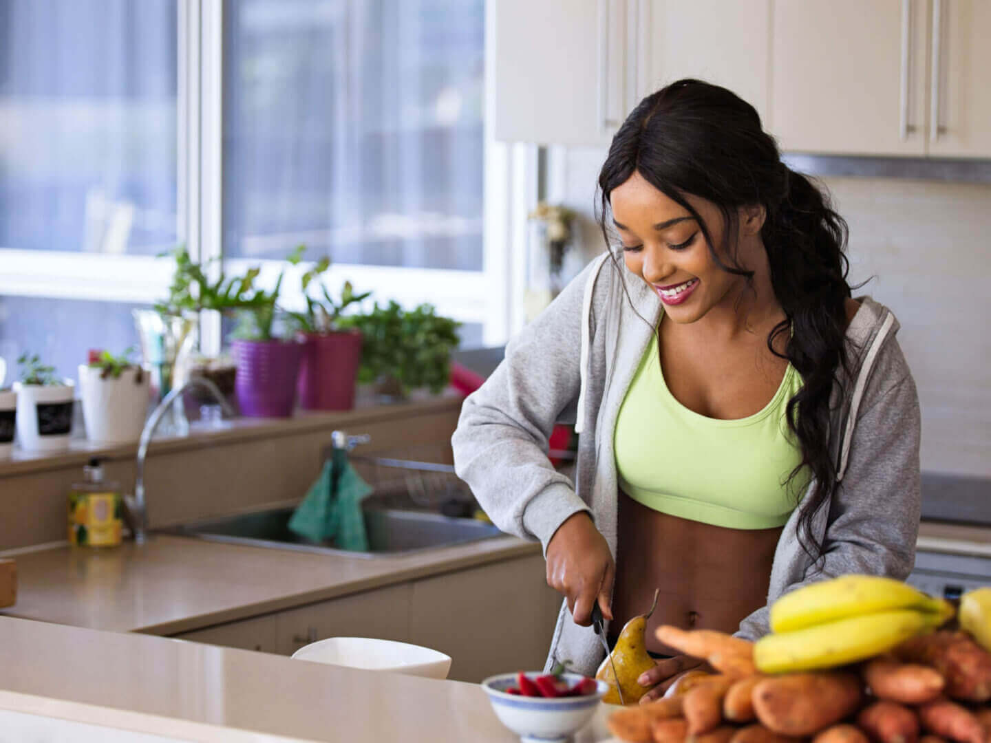 Fit woman preparing healthy snack